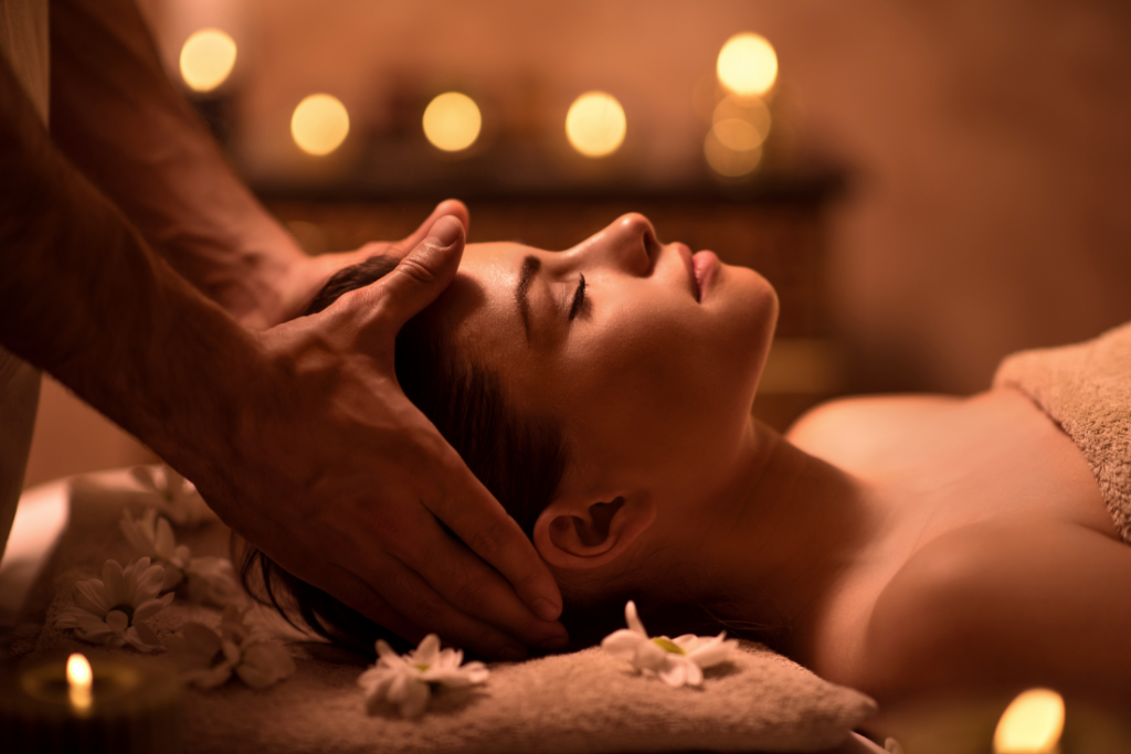 A women taking head massage for hair growth