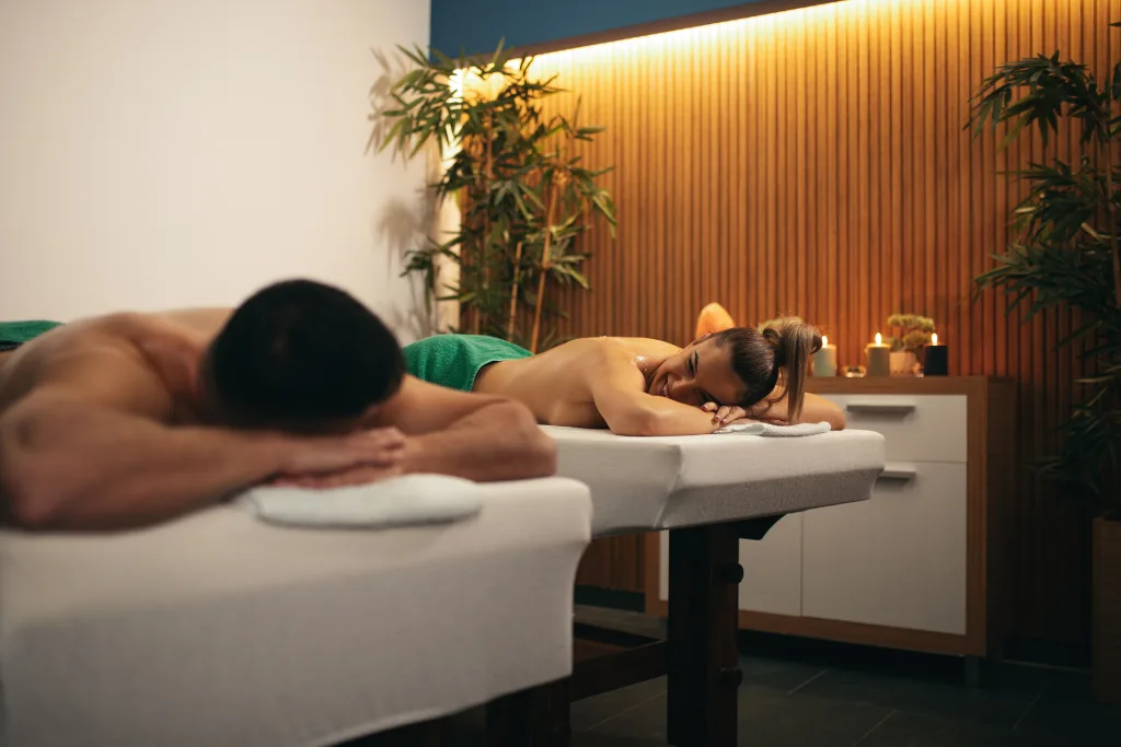 A couple unwinds during a massage, illustrating how shared experiences like this can contribute to a stronger bond in a relationship.