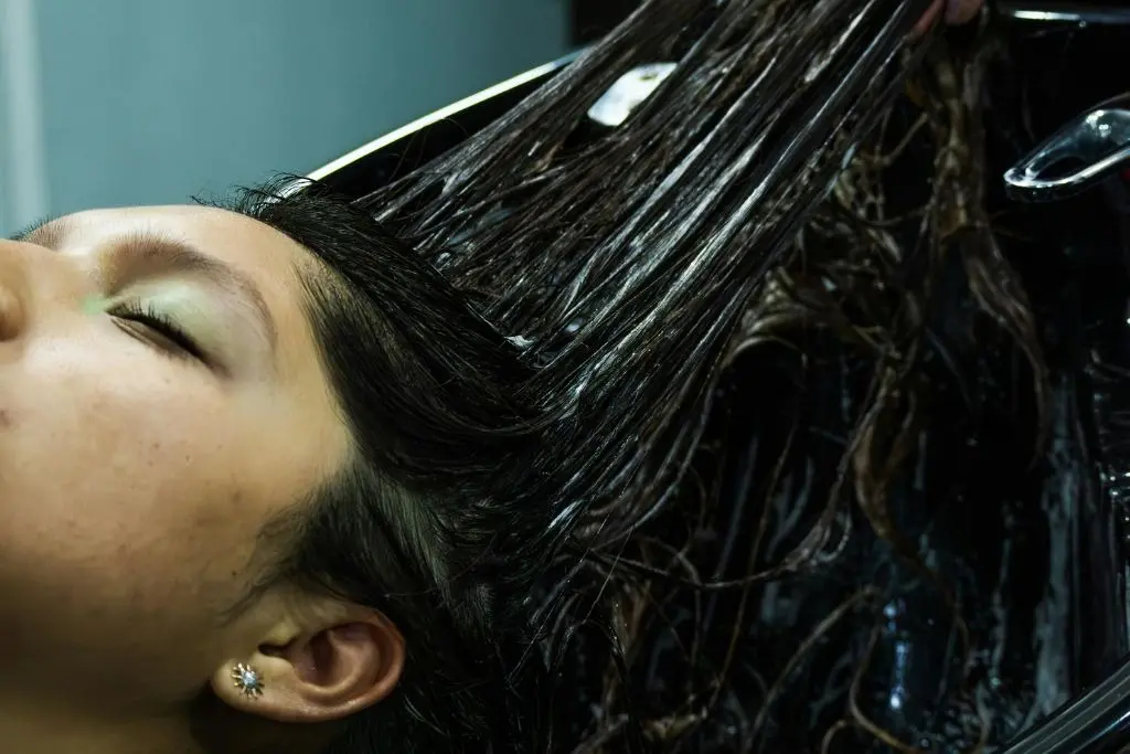 Relaxing head spa treatment for hair rejuvenation and scalp care.