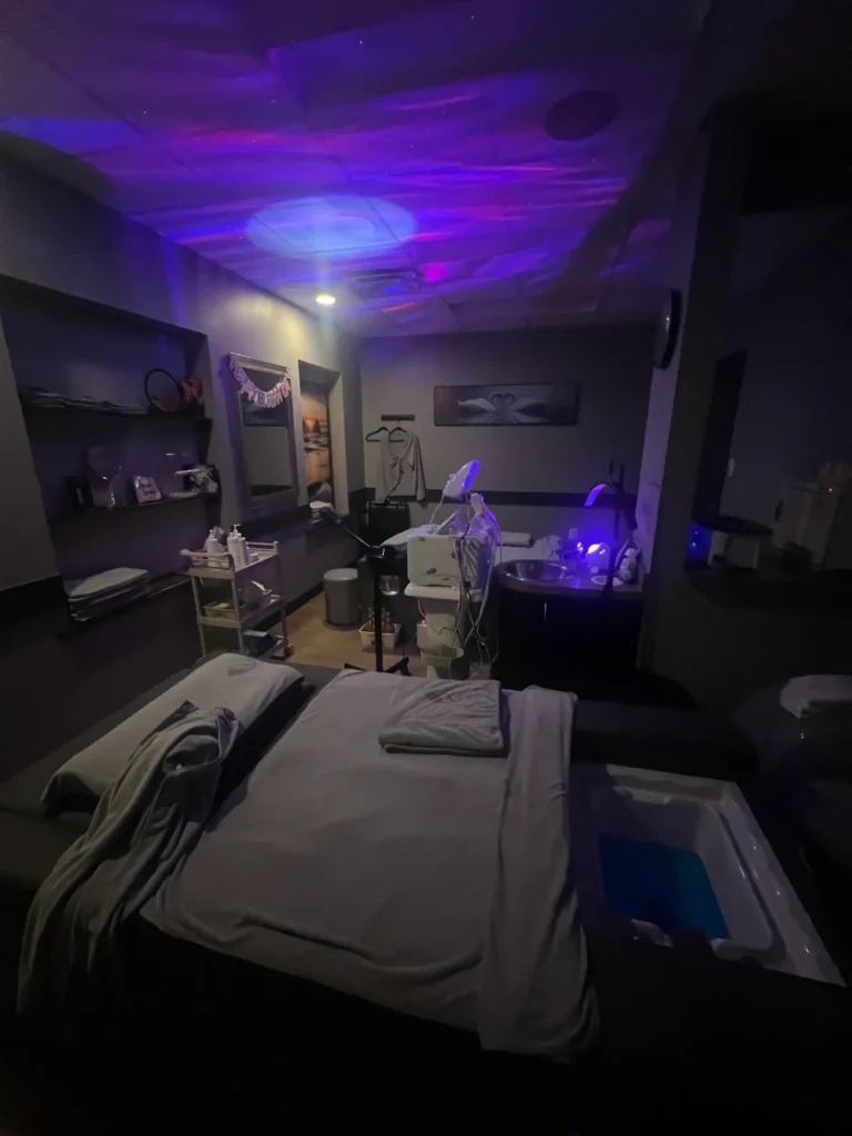 Relaxing Spa Treatment Room With Specialized Therapy Equipment And Colorful Ambient Lighting.